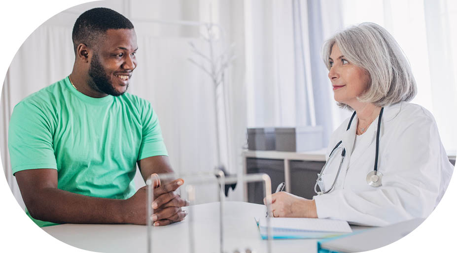 Young male patient having consultation with doctor, in the clinic